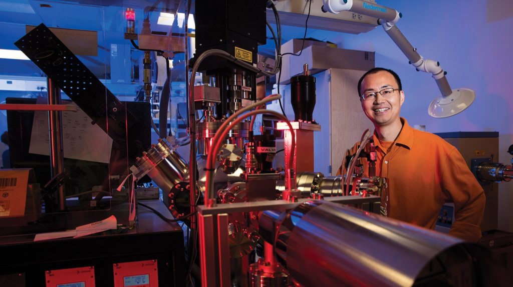 Xiaoshan Xu from physics and astronomy received a NSF CAREER award. He works with vaporizing materials to put a nano thin film of the material onto sapphire. August 31, 2015. Photo by Craig Chandler / University Communications