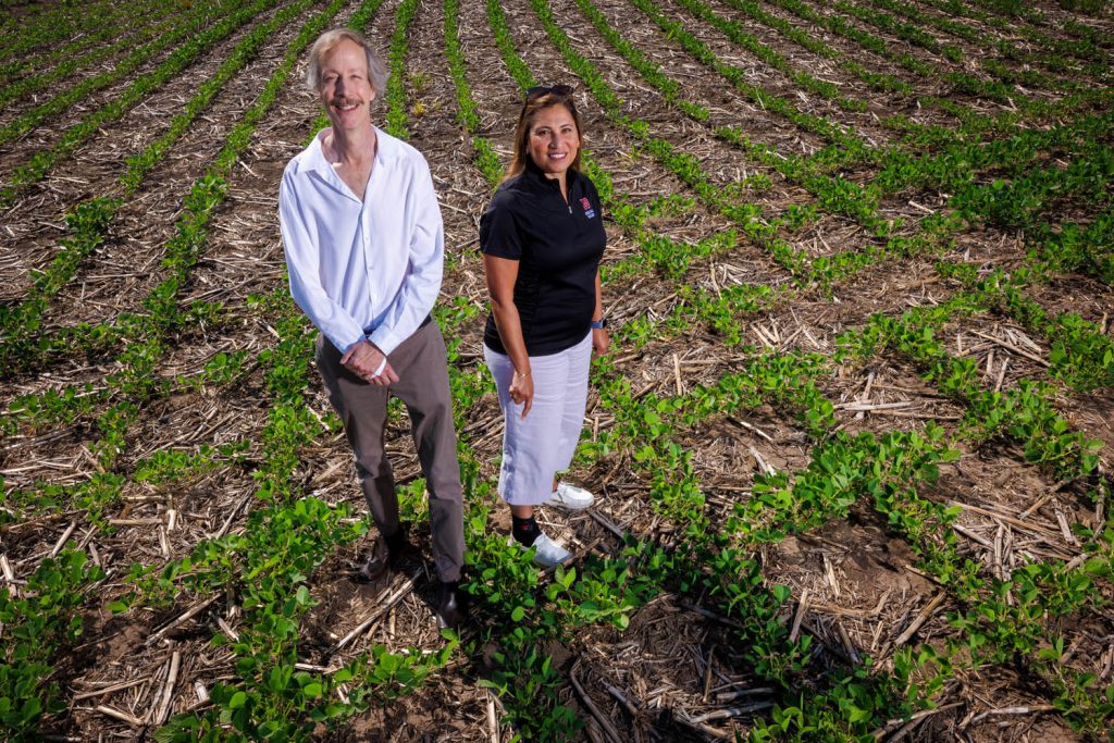 Craig Allen and Tala Awada in a field