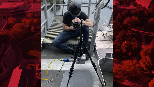 Tim Carlson watching laser system on patch of aluminum alloy