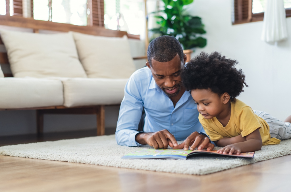 stock photo of father reading to child