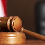 stock image of gavel on court bench