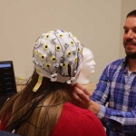 Kevin Pitt preparing EEG cap for use on speller device