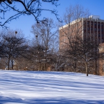 A snow-covered scene in front of Oldfather Hall.