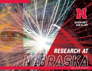 Cover of the 2021-2022 Research Report, featuring a particle physics collision.