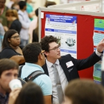 students at research poster session