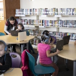 elementary students working on computers