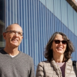 Peter Sutter and Eli Sutter in front of building