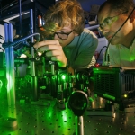 Abdelghani Laraoui works with student Ben Hammons on laser equipment