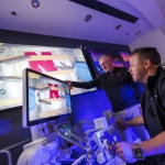 Shane Farritor and Dr. Michael Jobst make a surgical robotic cut on the International Space Station