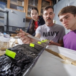 Doctoral student Jim Benes and UCARE students Jasmine Pham and Joe Stalder in lab