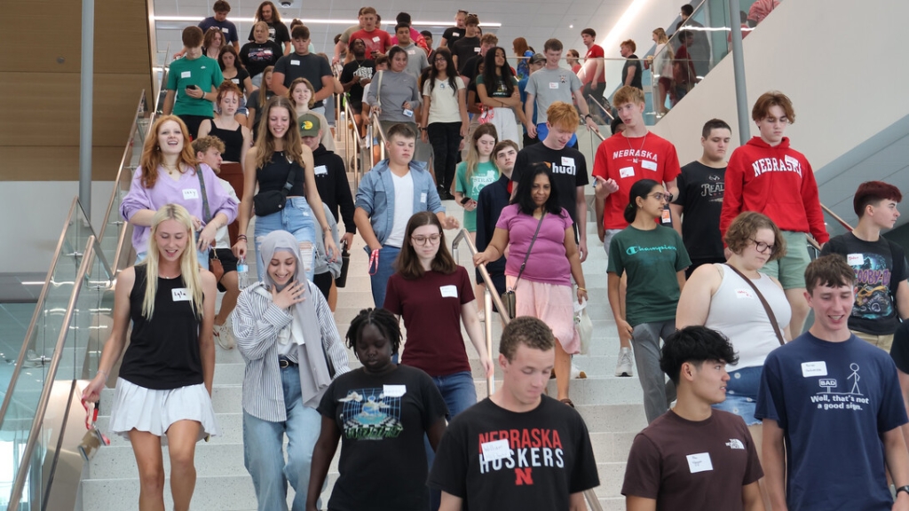 Engineering students walking down stairs at Kiewit Hall