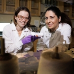 Alyssa Grube and Mona Bavarian hold a textile-based supercapacitor.