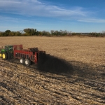 Tractor and trailer in farm field