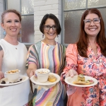 Three women - Nicole Sexton, Eileen Hebets and Angie Pannier - pose with plates of appetizers featuring edible insects.